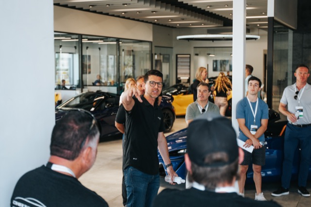 Event host speaking at a McLaren activation